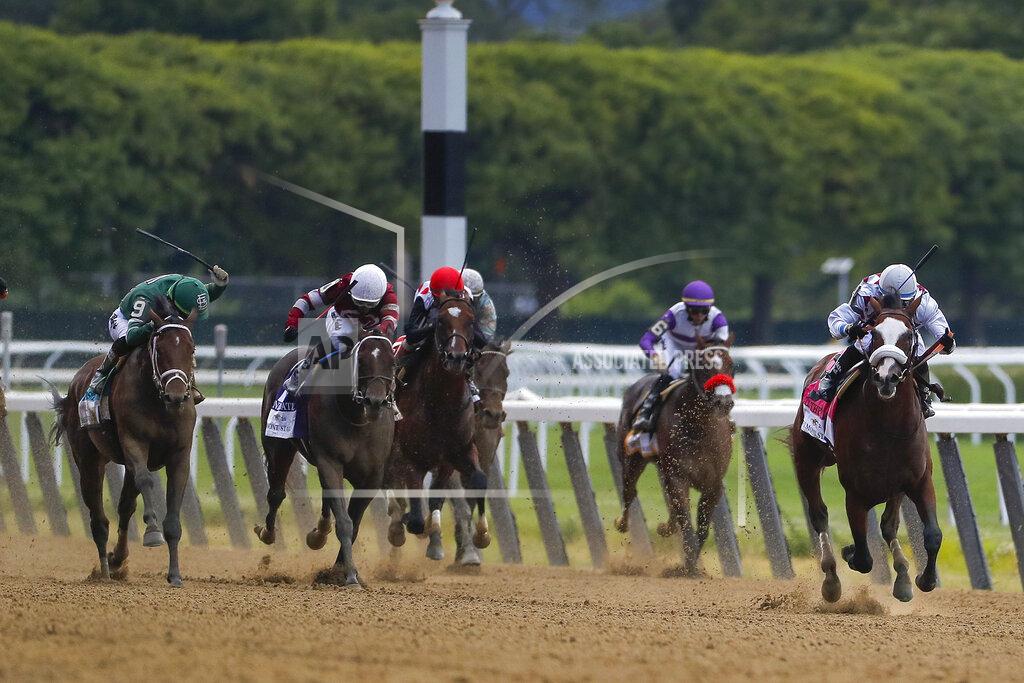 Seth Wenig Tiz the Law (8), with jockey Manny Franco up, right, leads the pack down the home stretch during the152nd running of the Belmont Stakes horse race, Saturday, June 20, 2020, in Elmont, N.Y. Tiz the Law won the race. (AP Photo/Seth Wenig)