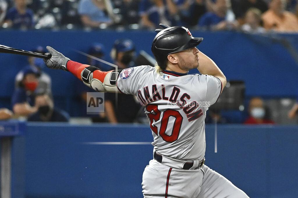 Jon Blacker Minnesota Twins' Josh Donaldson follows through on a solo home run against the Toronto Blue Jays during the third inning of a baseball game Friday, Sept. 17, 2021, in Toronto. (Jon Blacker/The Canadian Press via AP)