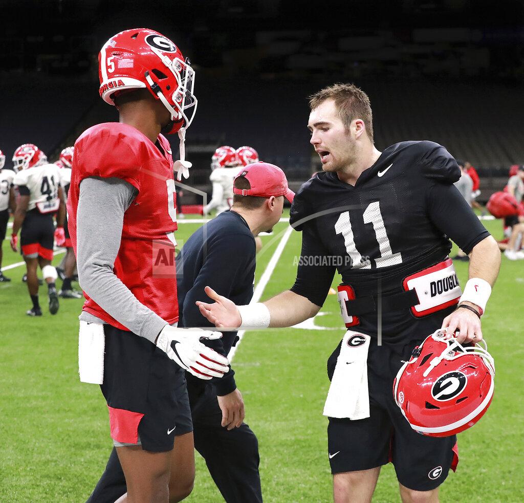 Curtis Compton Georgia quarterback Jake Fromm, right, gives wide receiver Matt Landres five after Landres caught a pass during team practice for the Sugar Bowl NCAA college football game against Baylor, Sunday, Dec. 29, 2019, in New Orleans. The game is to be played Wednesday, Jan. 1, 2020. (Curtis Compton/Atlanta Journal-Constitution via AP)