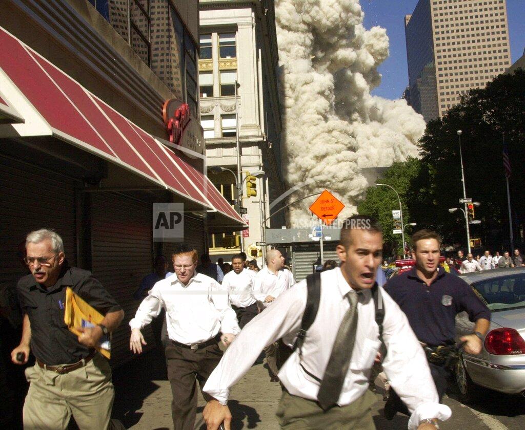 Suzanne Plunkett FILE - In this Tuesday, Sept. 11, 2001 file phtoo, people run away from a collapsing World Trade Center tower in New York. Al-Qaida's 9/11 attacks against the U.S. killed almost 3,000 people. (AP Photo/Suzanne Plunkett)