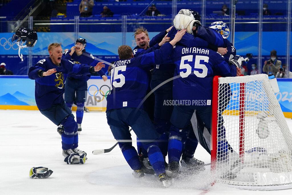 Matt Slocum Finland players celebrate after beating Russian Olympic Committee to win the men's gold medal hockey game at the 2022 Winter Olympics, Sunday, Feb. 20, 2022, in Beijing. (AP Photo/Matt Slocum)