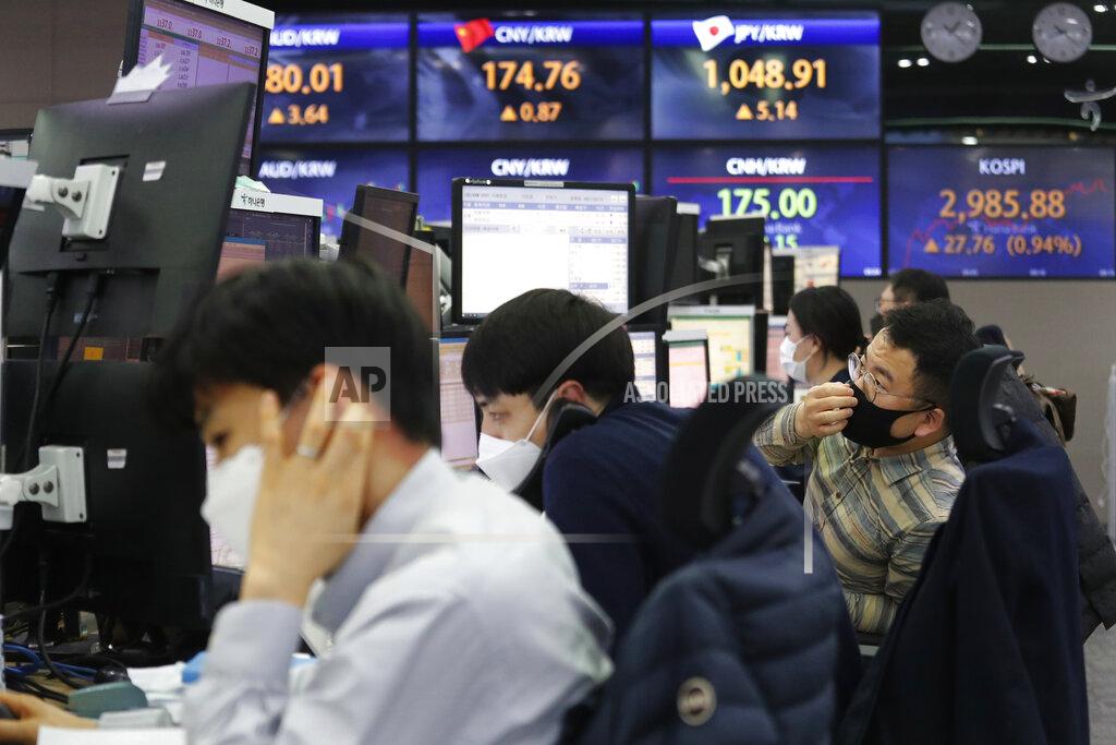 Ahn Young-Joon A currency trader watches monitors at the foreign exchange dealing room of the KEB Hana Bank headquarters in Seoul, South Korea, Thursday, March 11, 2021. Stocks climbed in Asia on Thursday after a key measure of inflation in the U.S. came in lower than expected, easing worries that price pressures could push interest rates higher. (AP Photo/Ahn Young-joon)