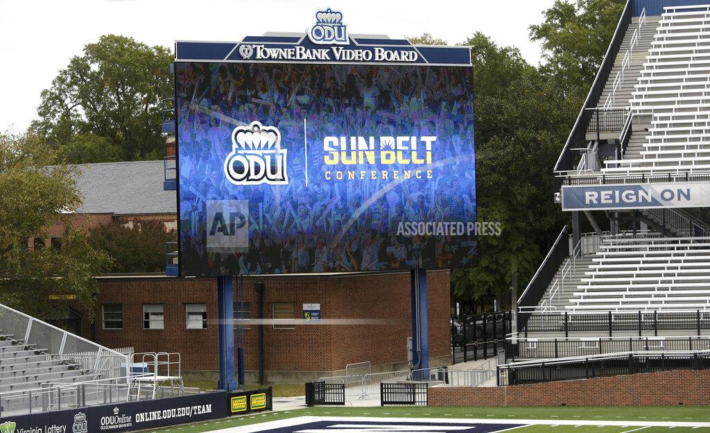 Stephen M. Katz The video board at Old Dominion University officially announces that the Monarchs are joining the Sun Belt Conference during a press conference Thursday, Oct. 28, 2021, in Norfolk, Va.. (Stephen M. Katz/The Virginian-Pilot via AP)