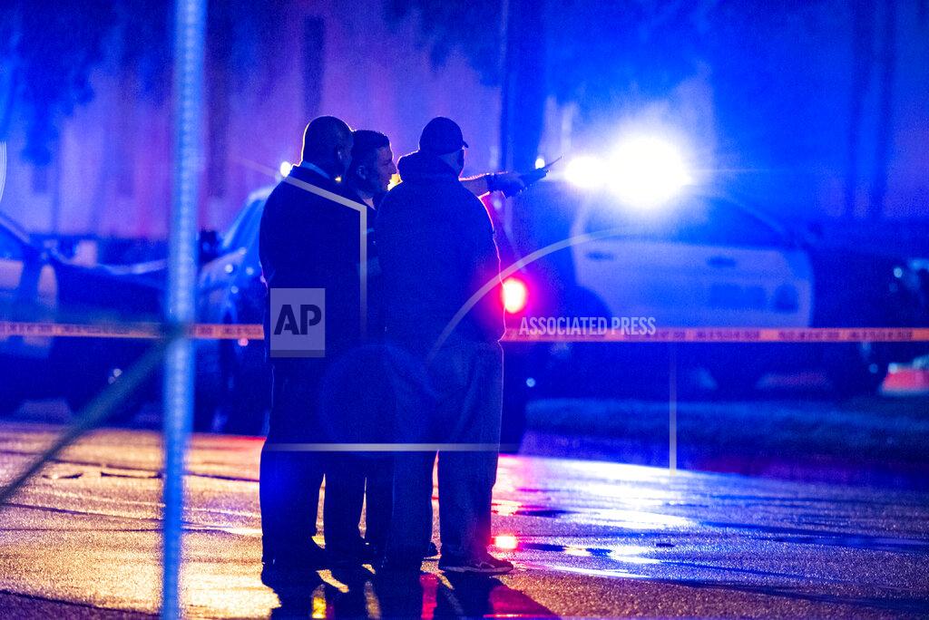 Leonard Ortiz FILE - In this March 1, 2020 file photo, Santa Ana detectives and officers investigate the scene where an armed man was shot by Santa Ana police at Immaculate Heart of Mary Church in Santa Ana, Calif., Sunday, March 1, 2020. Detectives nationwide are grappling with changes the coronavirus has wrought on their investigations. Cold cases are getting colder, plainclothes investigators are digging out their dusty uniforms for patrol duty, and detectives are struggling to find new ways to connect with victims through thick masks. Even as police departments report major decreases in crime statistics thanks to stay-at-home orders, authorities say enough wrongdoing abounds to keep cops busy. And some detective work must still be in-person and hands-on, despite COVID-19. (Leonard Ortiz/The Orange County Register/SCNG via AP, File)
