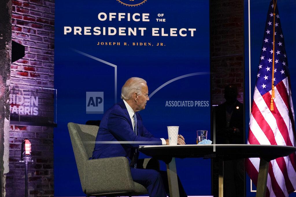 Carolyn Kaster President-elect Joe Biden listens during a meeting with his COVID-19 advisory council, Monday, Nov. 9, 2020, at The Queen theater in Wilmington, Del. (AP Photo/Carolyn Kaster)