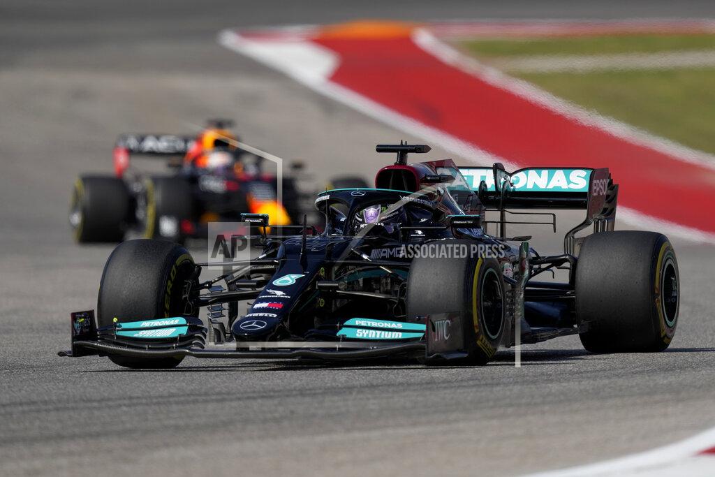 Nick Didlick Mercedes driver Lewis Hamilton, of Britain, leads Red Bull driver Max Verstappen, of the Netherlands, during the Formula One U.S. Grand Prix auto race at the Circuit of the Americas, Sunday, Oct. 24, 2021, in Austin, Texas. (AP Photo/Nick Didlick)