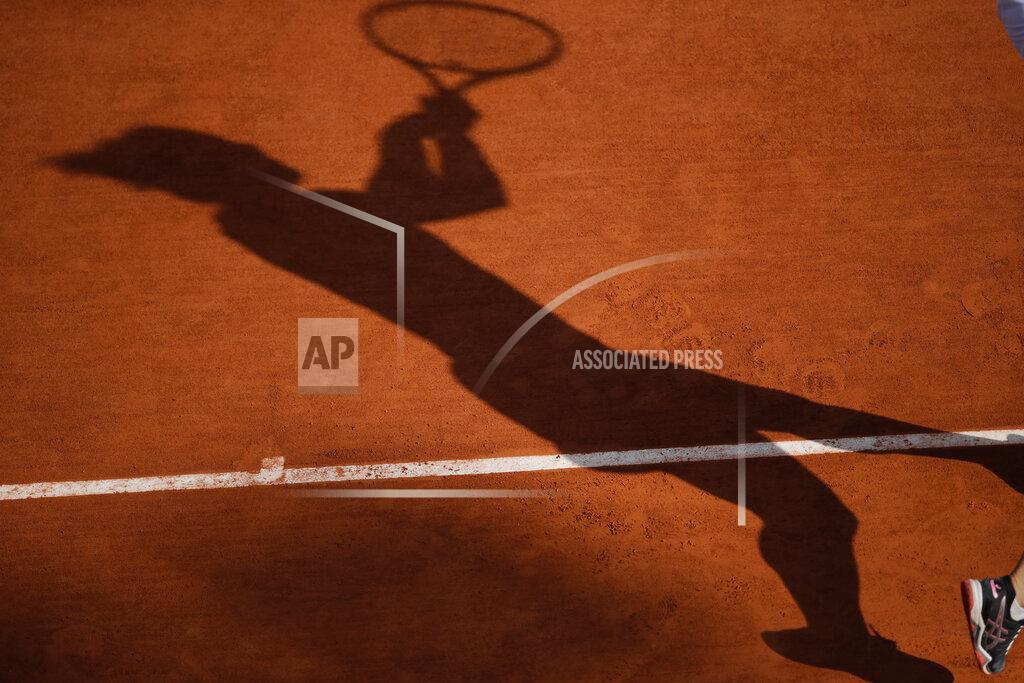 Christophe Ena Italy's Martina Trevisan casts a shadow as she plays a shot against Netherlands' Kiki Bertens in the fourth round match of the French Open tennis tournament at the Roland Garros stadium in Paris, France, Sunday, Oct. 4, 2020. (AP Photo/Christophe Ena)