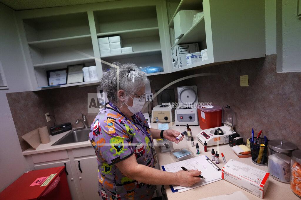 Rebecca Blackwell Lab technician Stephannie Chaffee prepares materials that will be used to test women's blood ahead of the arrival of patients, Saturday, Oct. 9, 2021, at Hope Medical Group for Women in Shreveport, La. The nation's most restrictive abortion law is driving many women from Texas to seek services in neighboring states. The abortion clinic in Shreveport is among the clinics being inundated. (AP Photo/Rebecca Blackwell)
