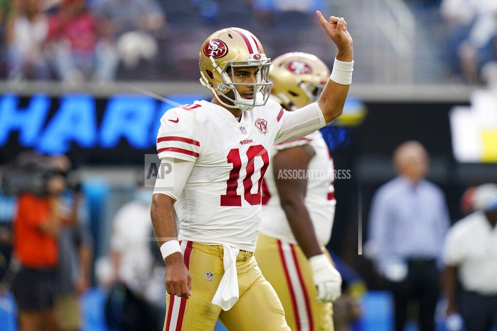 Jae C. Hong San Francisco 49ers quarterback Jimmy Garoppolo signals during the first half of a preseason NFL football game against the Los Angeles Chargers Sunday, Aug. 22, 2021, in Inglewood, Calif. (AP Photo/Jae C. Hong)