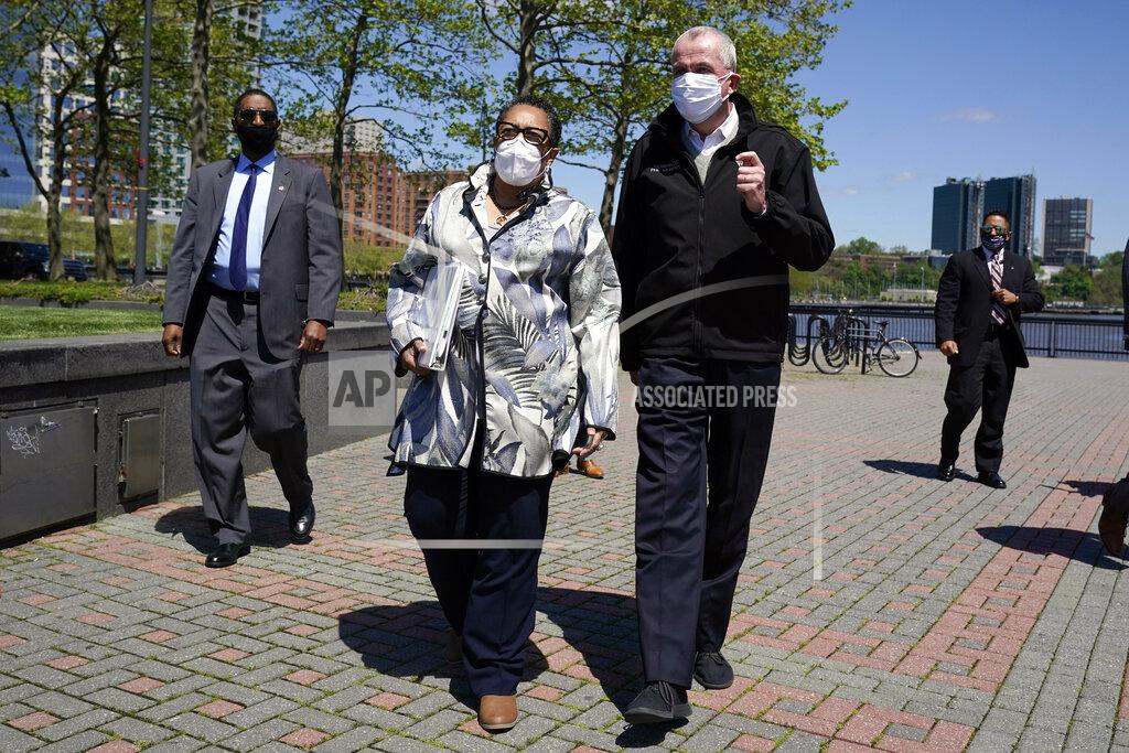 Seth Wenig Housing and Urban Development Secretary Marcia Fudge, second from left, and New Jersey Gov. Phil Murphy talk as they walk towards a news conference in Hoboken, N.J., Thursday, May 6, 2021. More than eight years after Superstorm Sandy overwhelmed the New York City area, Hoboken is breaking ground on a flood resiliency project that is part of a $230 million plan funded by the U.S. Department of Housing and Urban Development. (AP Photo/Seth Wenig)
