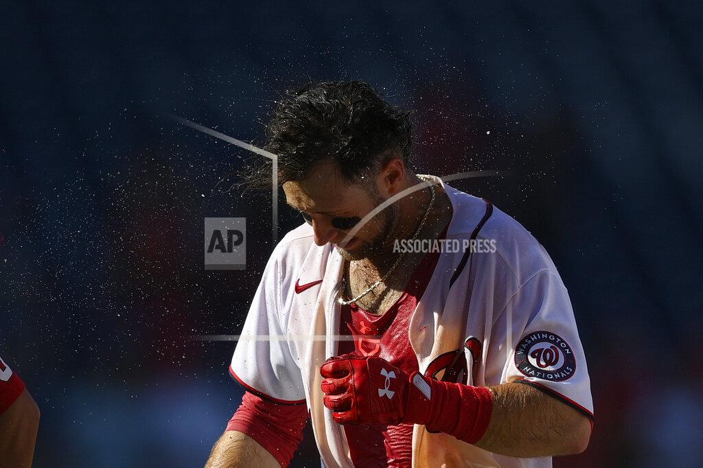 Nick Wass Washington Nationals' Carter Kieboom shakes his head after he was doused and continues to celebrate his walkoff single in the ninth inning that drove in Josh Bell after a baseball game against the New York Mets, Monday, Sept. 6, 2021, in Washington. (AP Photo/Nick Wass)