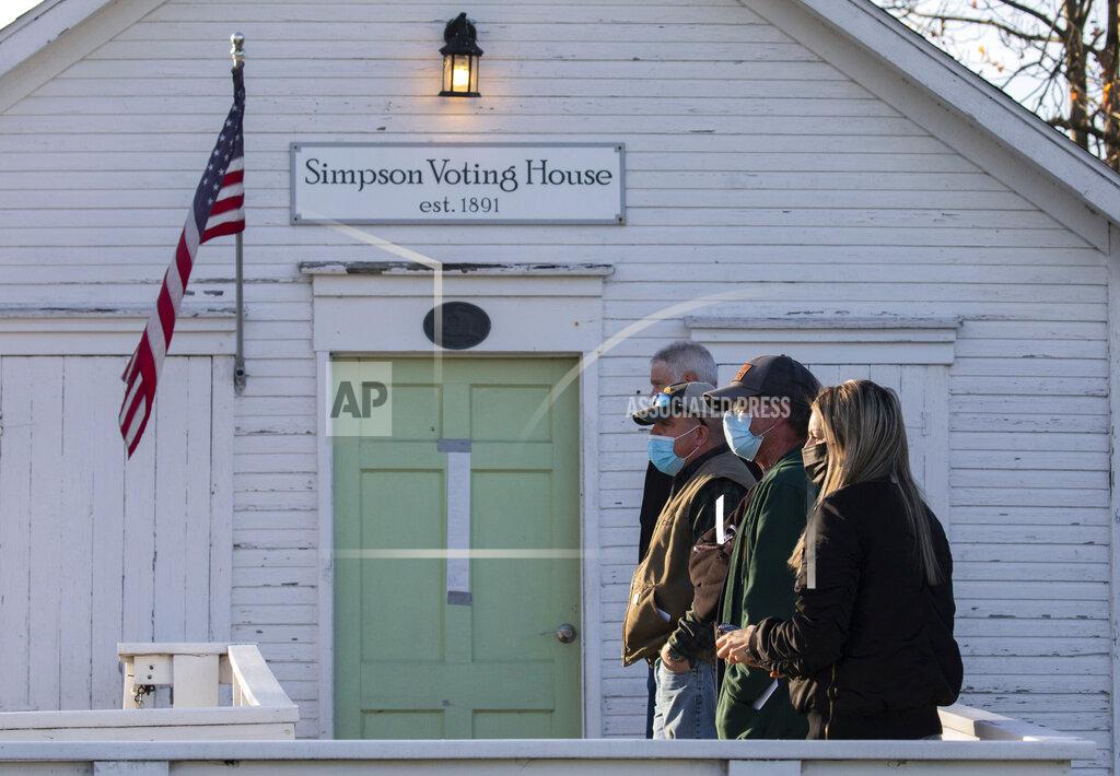 Andrew Rush Voters wait in line outside the Simpson Voting House polling place on Tuesday, Nov. 3, 2020, in Derry Township, Pa.. (Andrew Rush/Pittsburgh Post-Gazette via AP)