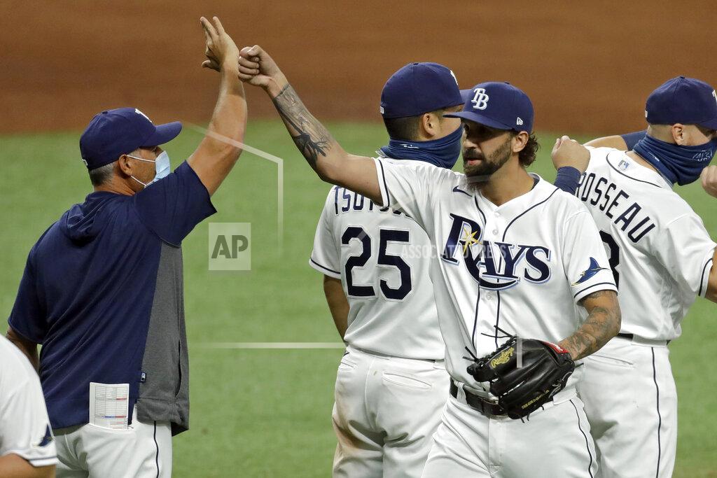 Chris O'meara Tampa Bay Rays relief pitcher Chaz Roe, right, celebrates with manager Kevin Cash after closing out the New York Yankees during the ninth inning of a baseball game Friday, Aug. 7, 2020, in St. Petersburg, Fla. (AP Photo/Chris O'Meara)