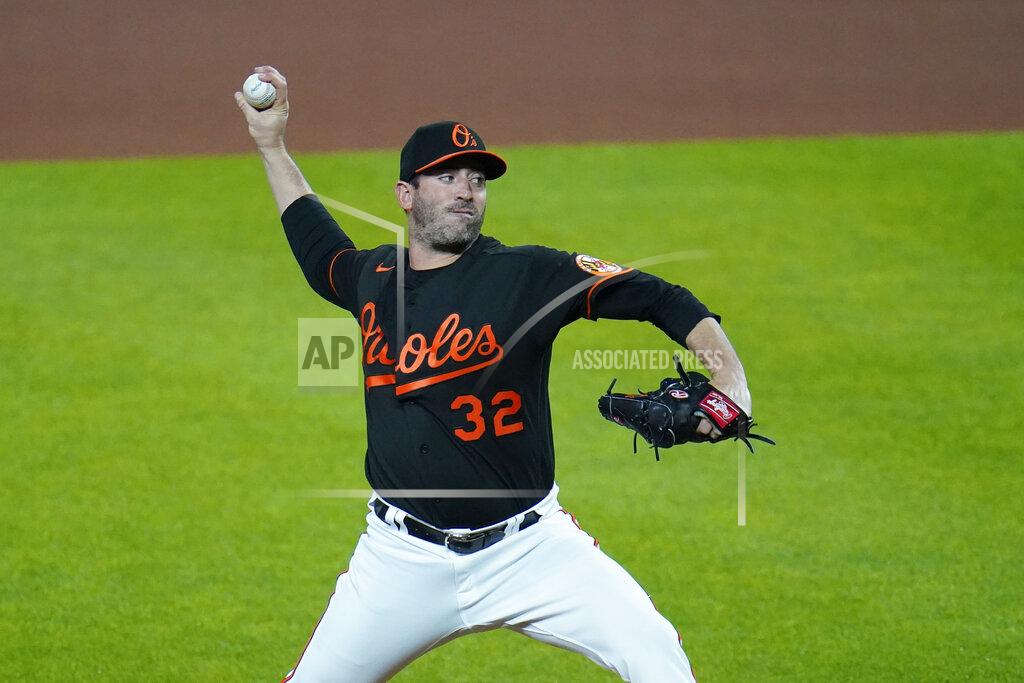 Julio Cortez Baltimore Orioles starting pitcher Matt Harvey throws a pitch to the wBoston Red Sox during the first inning of a baseball game, Friday, May 7, 2021, in Baltimore. (AP Photo/Julio Cortez)
