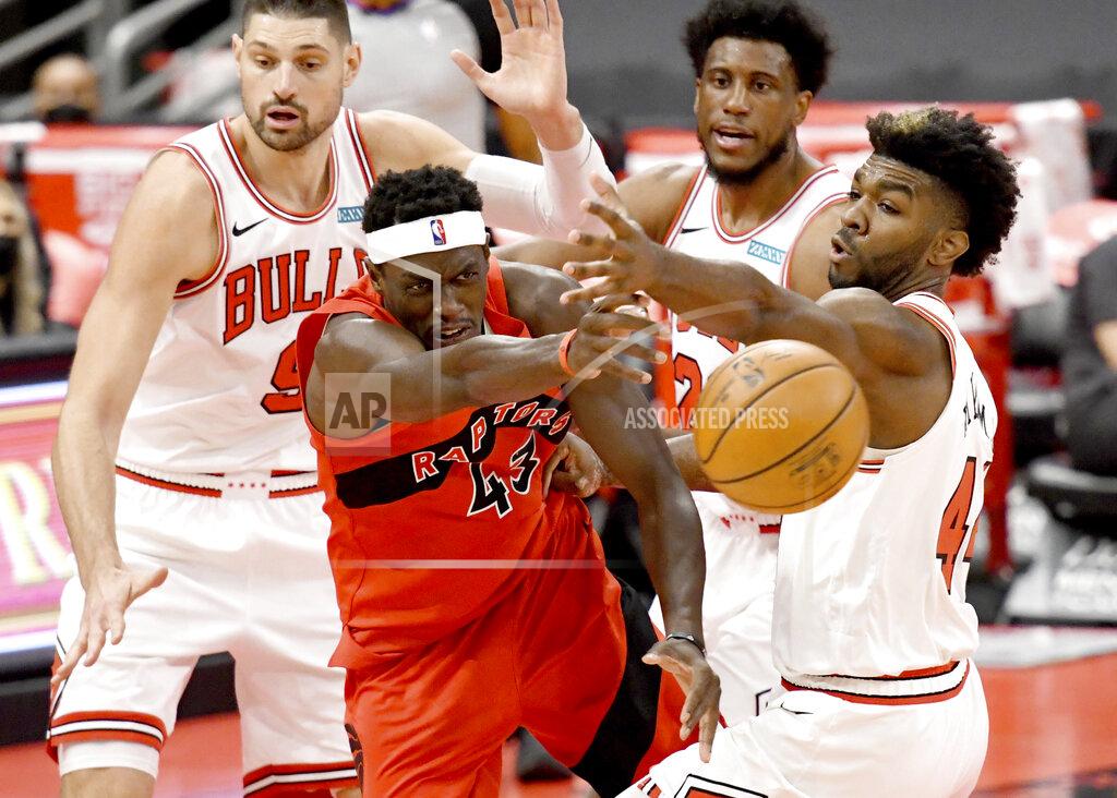 Jason Behnken Toronto Raptors forward Pascal Siakam (43) passes the ball past Chicago Bulls' Patrick Williams, right, during the second half of an NBA basketball game Thursday, April 8, 2021, in Tampa, Fla. (AP Photo/Jason Behnken)