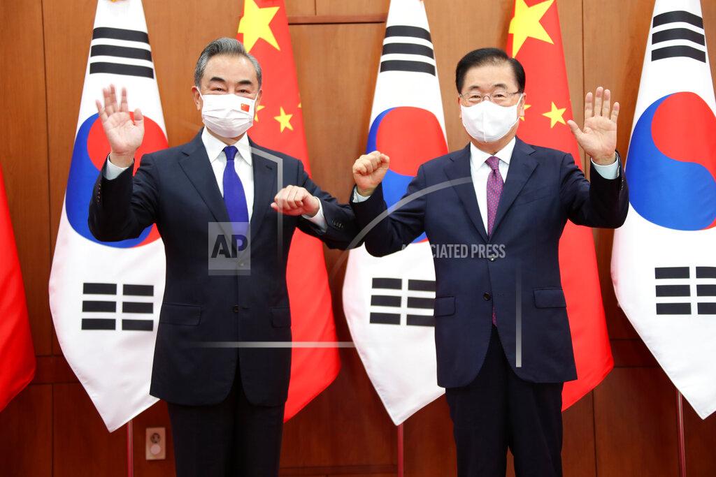 Kim Seung-Doo Chinese Foreign Minister Wang Yi, left, poses with his South Korean counterpart Chung Eui-yong for a photograph before their meeting at the Foreign Ministry in Seoul, South Korea, Wednesday, Sept. 15, 2021. The foreign ministers met Wednesday for talks expected to focus on North Korea and other regional security issues, two days after North Korea claimed to have tested a newly developed cruise missile. (Kim Seung-doo/Yonhap via AP)