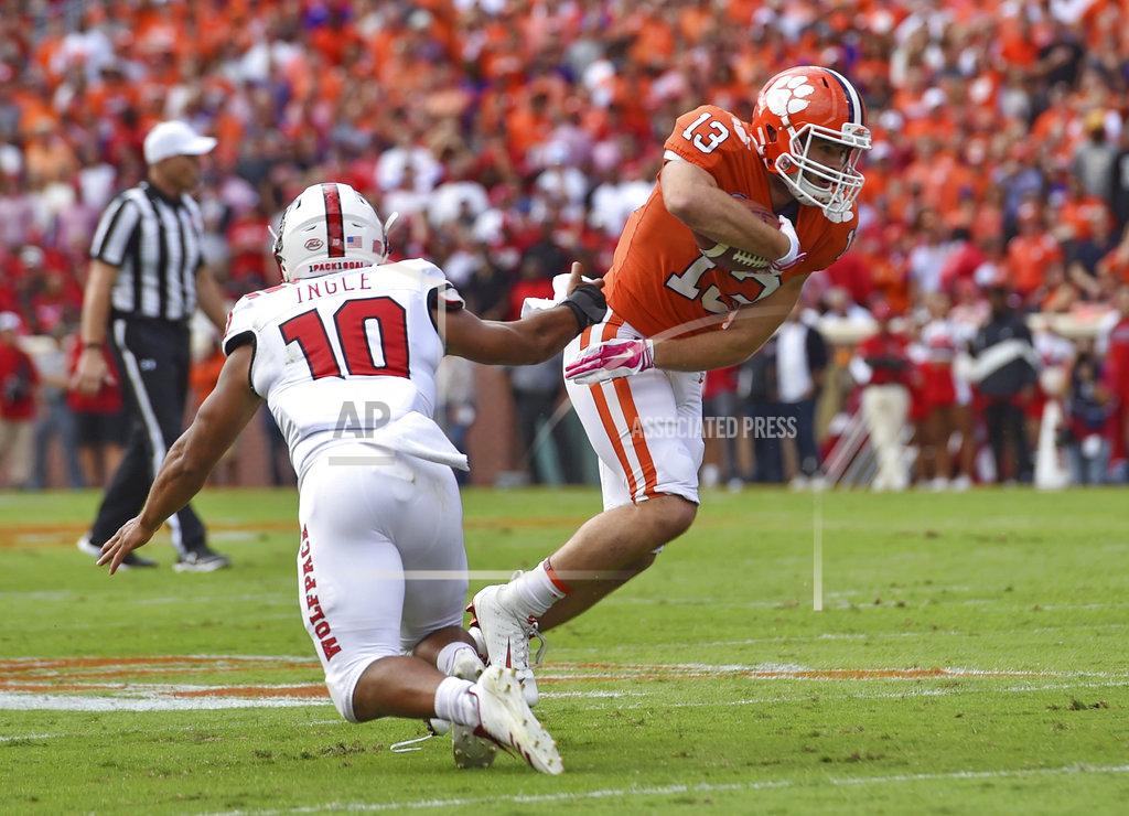 Richard Shiro Clemson's Hunter Renfrow avoids the tackle attempt by North Carolina State's Tanner Ingle after a pass reception during the first half of an NCAA college football game Saturday, Oct. 20, 2018, in Clemson, S.C. (AP Photo/Richard Shiro)