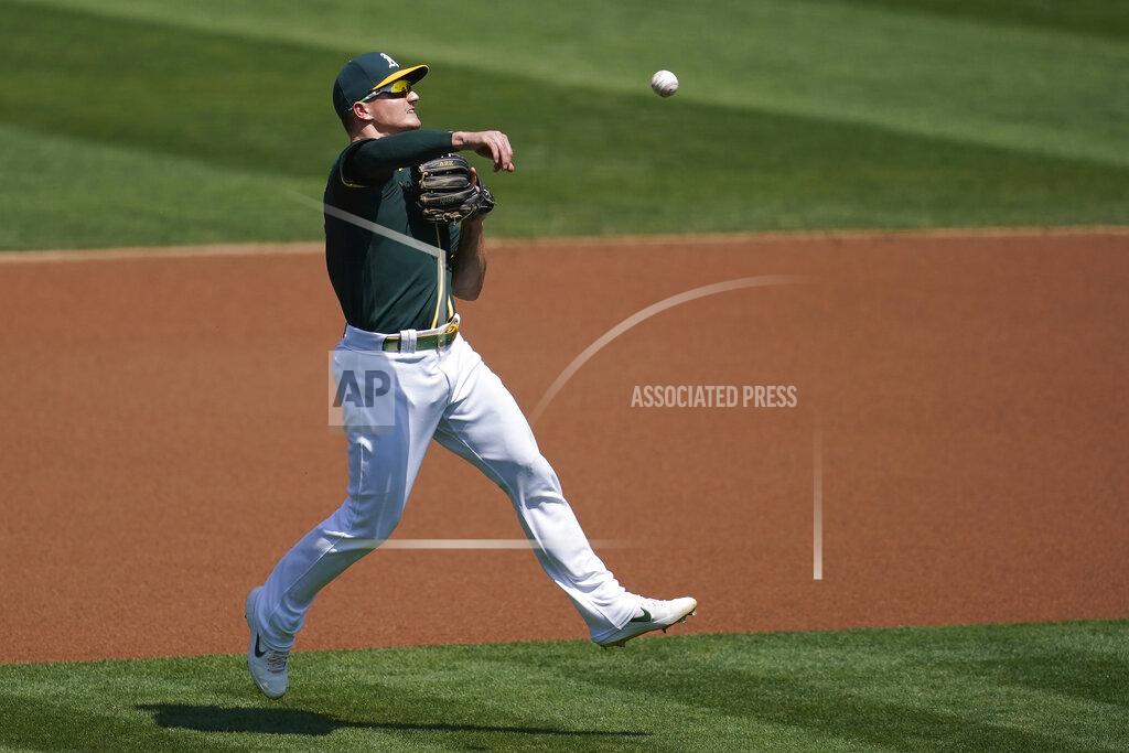 Jeff Chiu Oakland Athletics third baseman Matt Chapman makes a throwing error on San Diego Padres' Manny Machado's ground ball during the first inning of a baseball game in Oakland, Calif., Saturday, Sept. 5, 2020. (AP Photo/Jeff Chiu)