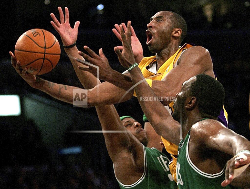 Branimir Kvartuc FILE - In this Feb. 23, 2007, file photo, Los Angeles Lakers' Kobe Bryant, top, goes up for a shot between Boston Celtics' Paul Pierce, left, and Al Jefferson during the first half of an NBA basketball game in Los Angeles. Kobe Bryant, Tim Duncan and Kevin Garnett are all expected to be officially announced as members of the 2020 enshrinement class for the Basketball Hall of Fame on Saturday, April 4, 2020. (AP Photo/Branimir Kvartuc, File)