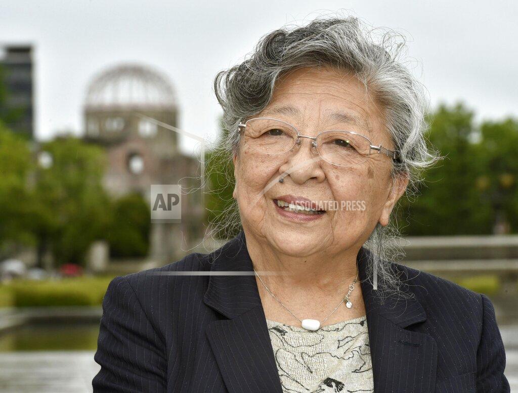 Uncredited Koko Kondo speaks at Hiroshima Peace Memorial Park with a backdrop of Atomic Bomb Dome in Hiroshima, western Japan, on June 6, 2018. Kondo, who survived the blast of the first atomic bomb as a baby, is the daughter of the Rev. Kiyoshi Tanimoto, one of six atomic bomb survivors featured in John Hersey's book “Hiroshima.” She struggled for decades until she reached middle age to overcome the pain she experienced in her teens and the rejection by her fiance. She was almost 40 when she decided to follow her father's path and become a peace activist. She was inspired by his last sermon, in which he spoke about devoting his life to Hiroshima's recovery. (Kyodo News via AP)