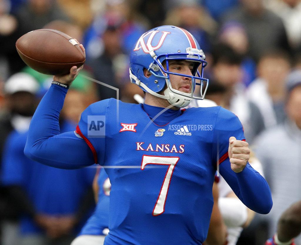 Orlin Wagner Kansas quarterback Peyton Bender (7) passes to a teammate during the first half of an NCAA college football game against Texas in Lawrence, Kan., Friday, Nov. 23, 2018. (AP Photo/Orlin Wagner)