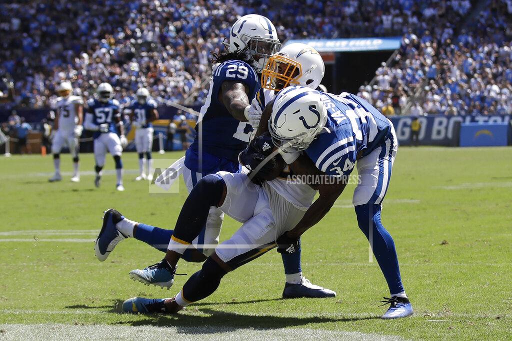 Marcio Jose Sanchez Los Angeles Chargers wide receiver Keenan Allen scores between Indianapolis Colts free safety Malik Hooker, left, and cornerback Rock Ya-Sin during the first half in an NFL football game Sunday, Sept. 8, 2019, in Carson, Calif. (AP Photo/Marcio Jose Sanchez)