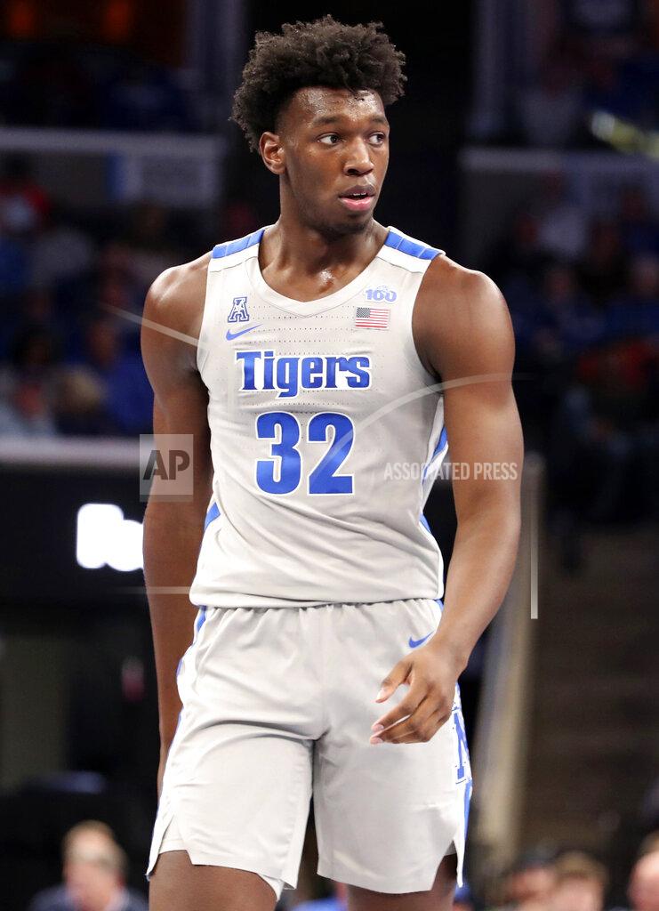 Karen Pulfer Focht FILE - In this Saturday, Nov. 9, 2019, file photo, Memphis' James Wiseman (32) pauses between plays in an NCAA college basketball game against University of Illinois-Chicago in Memphis, Tenn. Wiseman says he has withdrawn from school as the likely NBA lottery pick gets ready to begin his pro career. (AP Photo/Karen Pulfer Focht, File)
