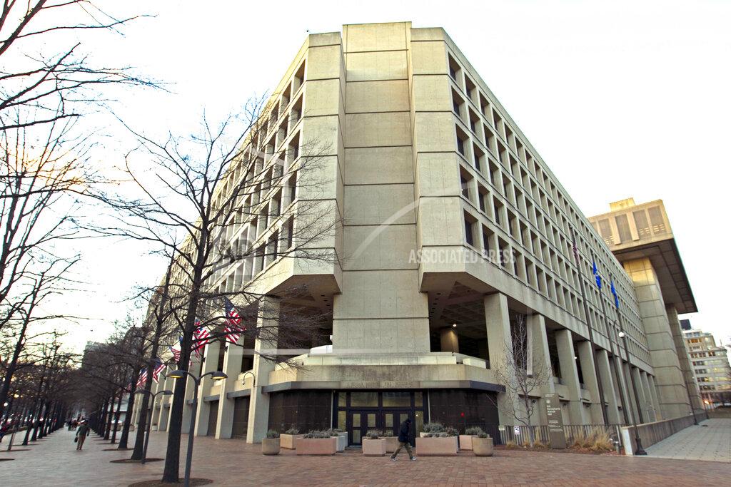 Jose Luis Magana This Friday, Feb. 2, 2018 file photo shows the Federal Bureau of Investigation building in Washington. On Friday, June 18, 2021, The Associated Press reported on a video circulating online incorrectly asserting the FBI headquarters building in Washington is completely closed, empty and walled off. A video spreading the false claim shows the back of the building rather than the main entrance, which was open and fully operational this week, according to a statement from the FBI and the observations of an AP reporter based nearby. (AP Photo/Jose Luis Magana, File)