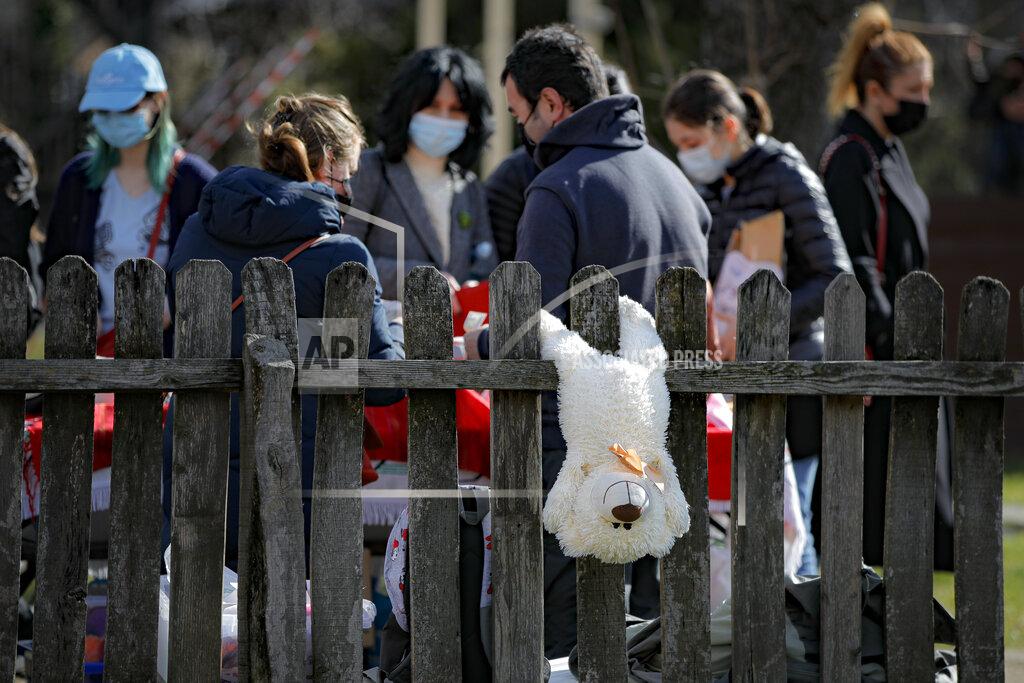 Vadim Ghirda A teddy bear hangs from a fence at a spring charms fair at the Dimitrie Gusti Village Museum in Bucharest, Romania, Sunday, Feb. 28, 2021. (AP Photo/Vadim Ghirda)