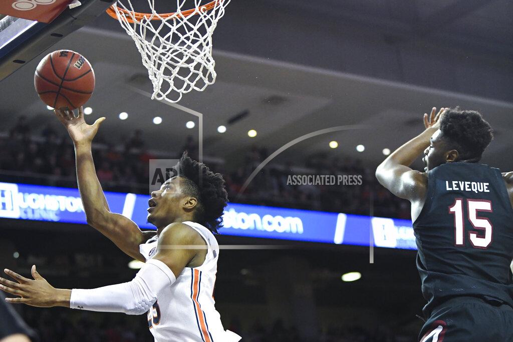Julie Bennett Auburn forward Isaac Okoro (23) scores two over South Carolina forward/center Wildens Leveque (15) during the second half of an NCAA college basketball game Wednesday, Jan. 22, 2020, in Auburn, Ala. (AP Photo/Julie Bennett)