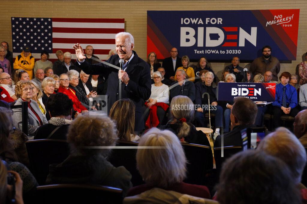 Democratic presidential candidate former Vice President Joe Biden speaks to local residents during a bus tour stop, Tuesday, Dec. 3, 2019, in Mason City, Iowa. (AP Photo/Charlie Neibergall)