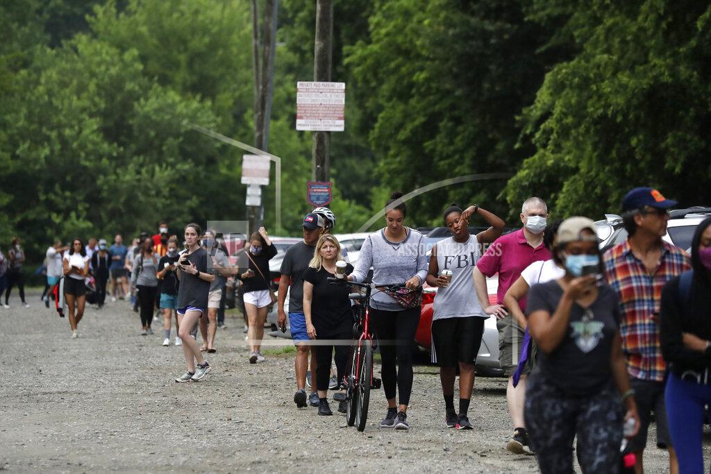 Brynn Anderson People wait in line to vote in the Georgia's primary election at Park Tavern on Tuesday, June 9, 2020, in Atlanta. (AP Photo/Brynn Anderson)