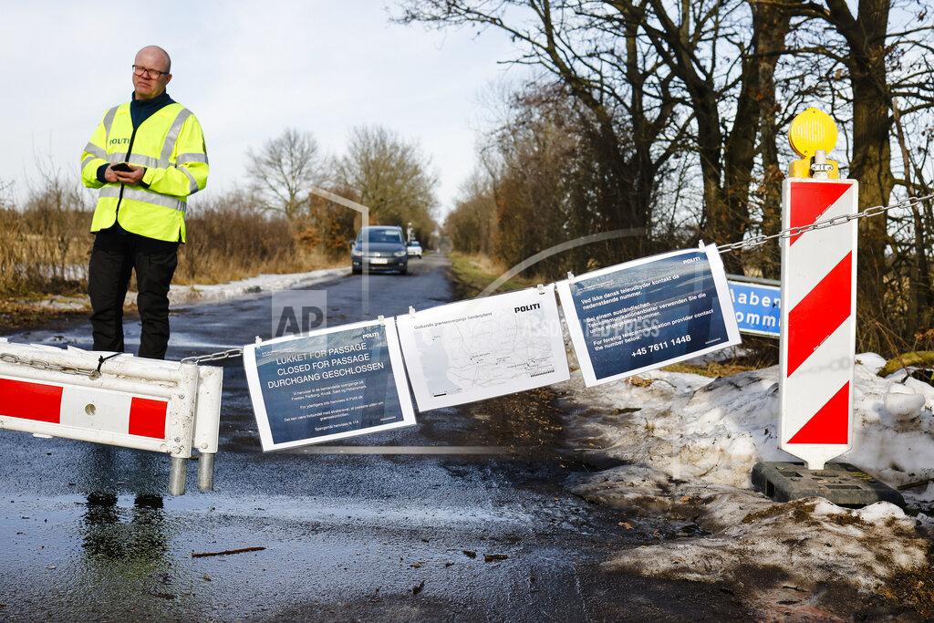 Frank Molter A Danish police officer guards a closed border crossing near Handewitt, Germany, Saturday, Feb. 20, 2021. Denmark has closed several smaller border crossings to Germany because of the coronavirus situation in the region near the city of Flensburg. (Frank Molter/dpa via AP)