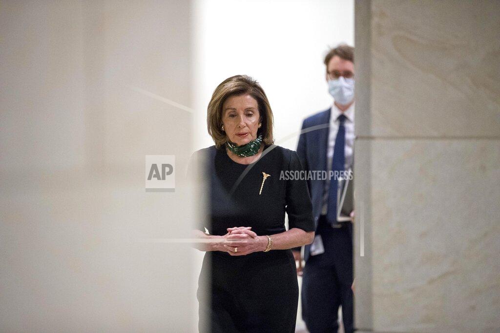 Andrew Harnik House Speaker Nancy Pelosi of Calif., arrives for a news conference on Capitol Hill, Thursday, May 14, 2020, in Washington. (AP Photo/Andrew Harnik)