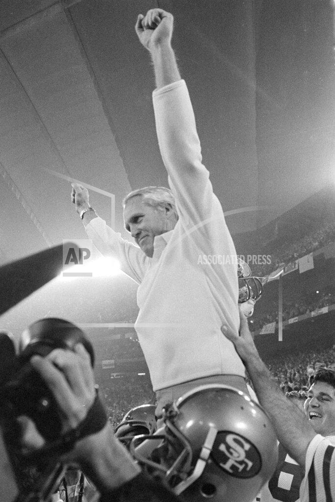 Uncredited FILE - In this Jan. 25, 1982, file photo, San Francisco 49ers coach Bill Walsh raises his arms in victory as he is carried off the field by his players after their 26-21 Super Bowl XVI win over Cincinnati Bengals in Pontiac, Mich. The San 49ers ruled most of the 1980s by winning Super Bowls after the 1981, '84, '88 and '89 seasons.(AP Photo/File)