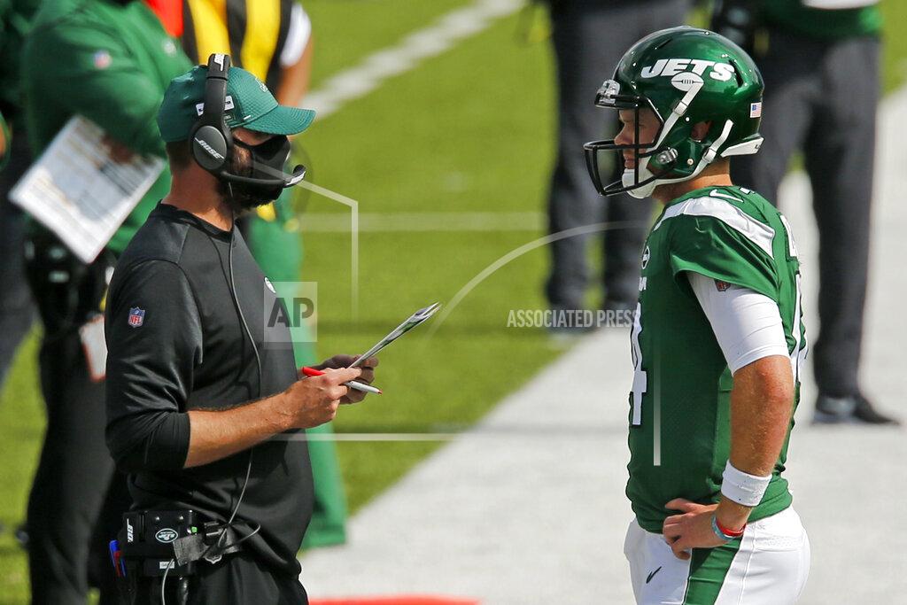 John Munson New York Jets head coach Adam Gase, left, talks with quarterback Sam Darnold during the second half of an NFL football game against the Buffalo Bills in Orchard Park, N.Y., Sunday, Sept. 13, 2020. (AP Photo/John Munson)