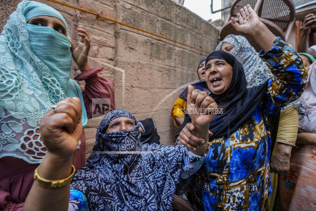 Mukhtar Khan Woman shout slogans demanding release of Kashmiri separatist leader Yasin Malik during a protest in Srinagar, Indian controlled Kashmir, Wednesday, May 25, 2022. Shops and business establishment in some parts of Srinagar remained closed ahead of the sentence hearing of Kashmiri separatist leader Yasin Malik. Malik is being tried on charges of terrorist acts, raising funds, conspiracy, a member of a terrorist organization, and criminal conspiracy and sedition. (AP Photo/Mukhtar Khan)
