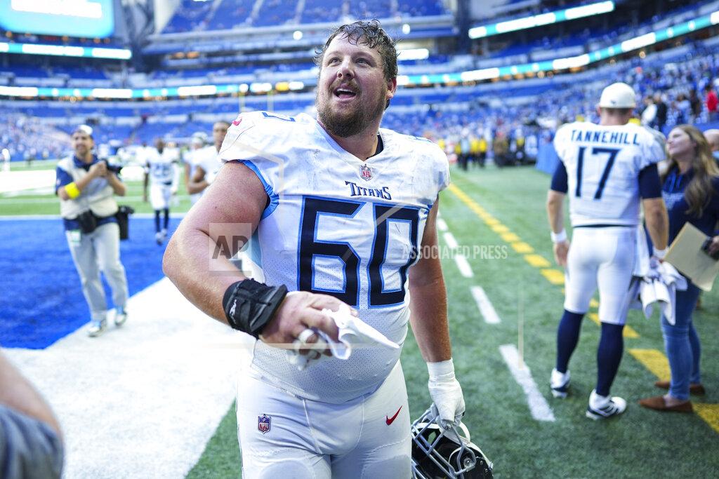 Aj Mast Tennessee Titans center Ben Jones throws a glove to a fan following an NFL football game against the Indianapolis Colts in Indianapolis, Fla., Sunday, Oct. 2, 2022. The Titans defeated the Colts 24-17. (AP Photo/AJ Mast)