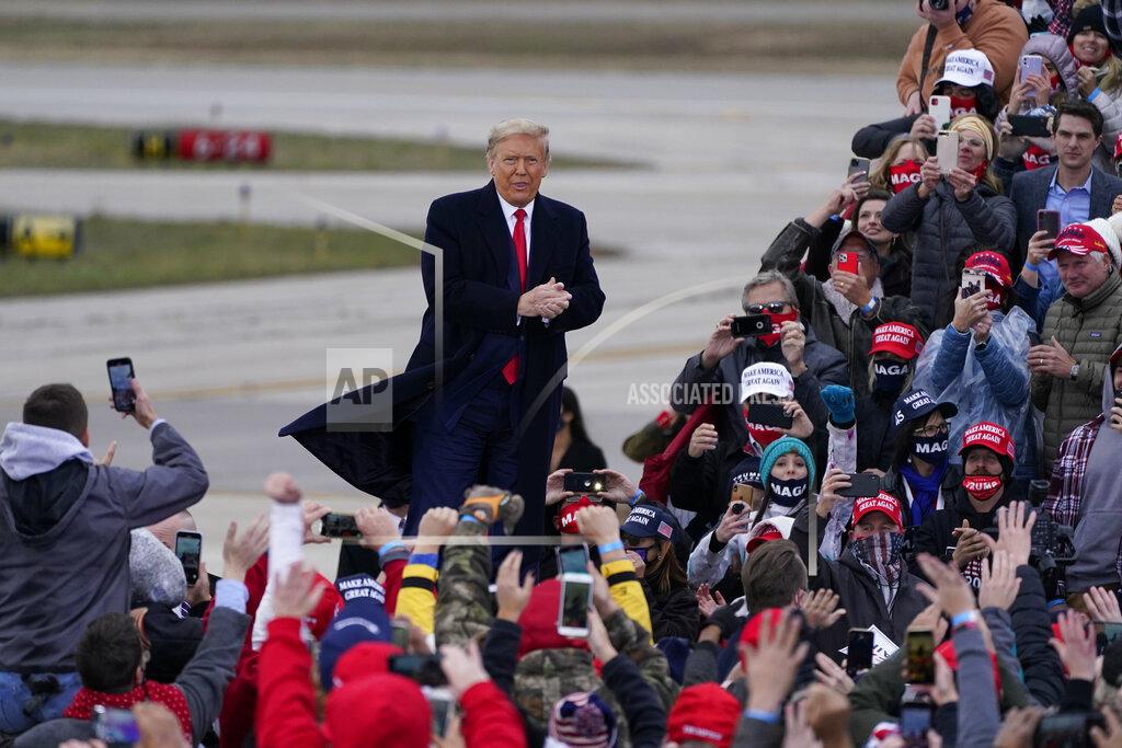 President Donald Trump arrives at a campaign rally, Saturday, Oct. 17, 2020, in Norton Shores, Mich. (AP Photo/Carlos Osorio)