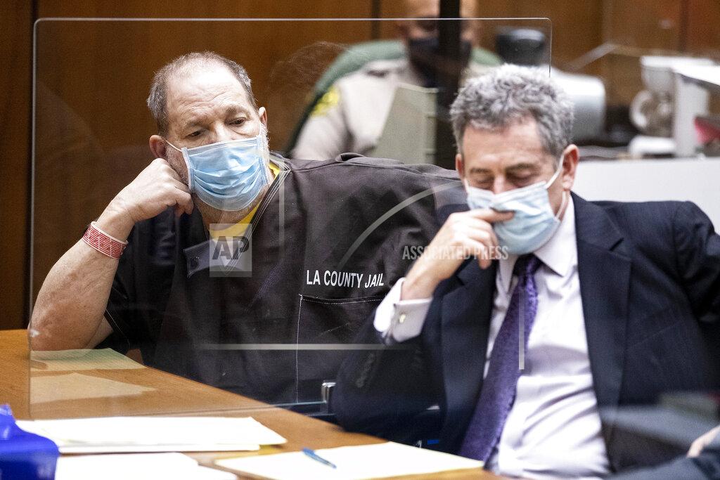Etienne Laurent Harvey Weinstein, left, the 69-year-old convicted rapist and disgraced movie mogul, listens alongside Mark Werksman, one of his attorneys, during a pre-trial hearing in Los Angeles, Thursday, 29 July 2021. (Etienne Laurent/Pool Photo via AP)