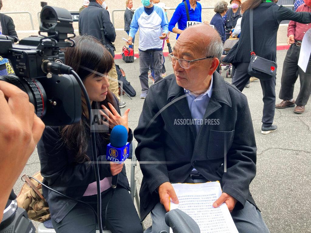 Damian Dovarganes Shoei Su, a retired appraiser, is interviewed by the media nearly a week after a deadly shooting at a Taiwanese American church congregation in Laguna Woods, Calif., Saturday, May 21, 2022. He said the shooter said nothing before firing on churchgoers who were snapping photos after finishing lunch following last Sunday morning's prayer service. (AP Photo/Amy Taxin)
