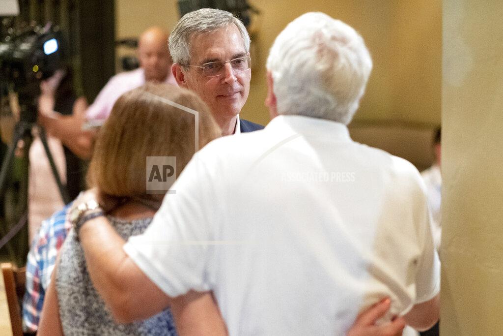 Ben Gray Incumbent Georgia Secretary of State Brad Raffensperger, talks with supporters during an election night party Tuesday evening, May 24, 2022 at a small restaurant in Peachtree Corners, Ga. (AP Photo/Ben Gray)