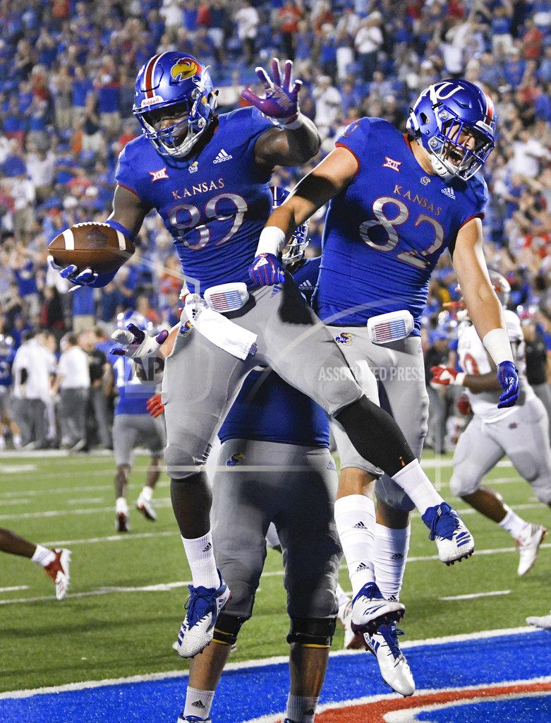 Reed Hoffmann Kansas tight end Mavin Saunders (89) celebrates a two-point conversion with teammate James Sosinski (82) against Nicholls State during the second half of an NCAA college football game in Lawrence, Kan., Saturday, Sept. 1, 2018. (AP Photo/Reed Hoffmann)
