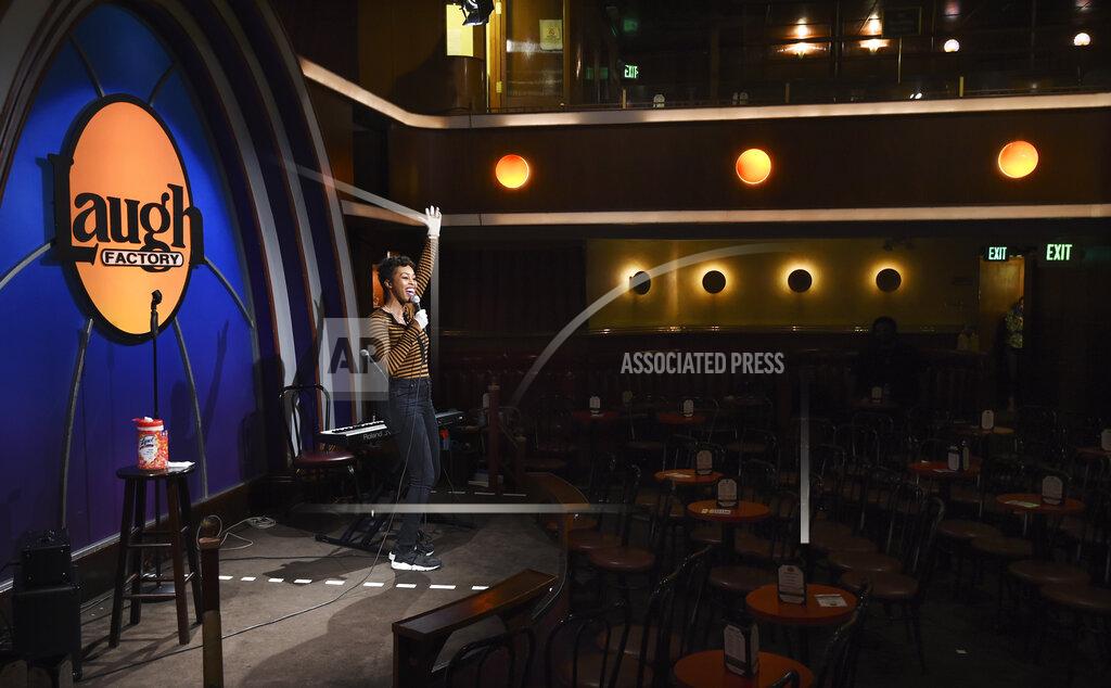 Chris Pizzello Comedian Daphnique Springs performs to an empty room during a "Laughter is Healing" stand-up comedy livestream event at the Laugh Factory comedy club, Monday, April 20, 2020, in Los Angeles. (AP Photo/Chris Pizzello)