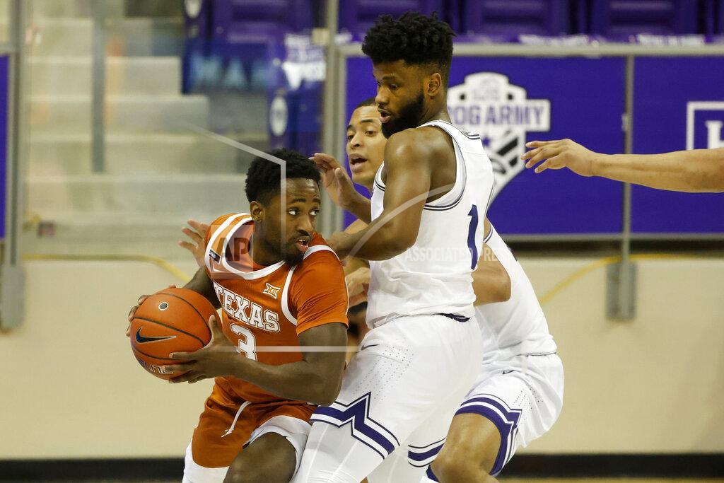 Michael Ainsworth Texas guard Courtney Ramey (3) looks to pass as he is defended by TCU guard Mike Miles (1) and forward Jaedon LeDee (23) during the second half of an NCAA college basketball game in Fort Worth, Texas, Sunday, March 7, 2021. (AP Photo/Michael Ainsworth)