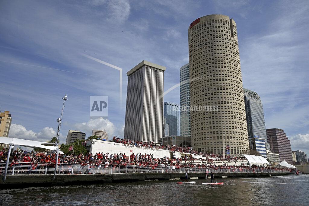 Phelan Ebenhack Fans watch the NFL football Tampa Bay Buccaneers celebrate their Super Bowl 55 victory over the Kansas City Chiefs with a boat parade in Tampa, Fla., Wednesday, Feb. 10, 2021. (AP Photo/Phelan Ebenhack)