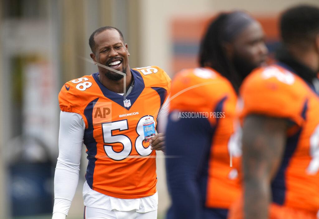 David Zalubowski Denver Broncos outside linebacker Von Miller, left, jokes with teammates as they take part in drills at an NFL football training camp Tuesday, Aug. 3, 2021, at team headquarters in Englewood, Colo. (AP Photo/David Zalubowski)