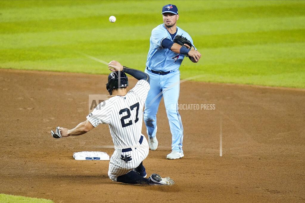 Frank Franklin Ii Toronto Blue Jays' Joe Panik throws out New York Yankees' Gleyber Torres at first base after forcing out Giancarlo Stanton, left, on a double play during the first inning of a baseball game Thursday, Sept. 17, 2020, in New York. (AP Photo/Frank Franklin II)