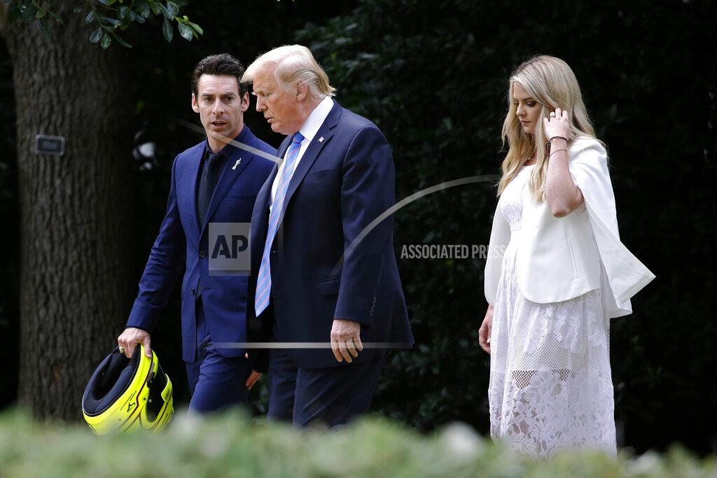 Patrick Semansky President Donald Trump walks with driver Simon Pagenaud, left, and Pagenaud's fiancee, Hailey McDermott, to the South Lawn at the White House, Monday, June 10, 2019, in Washington for an event to honor Team Penske for the 2019 Indianapolis 500 win. (AP Photo/Patrick Semansky)