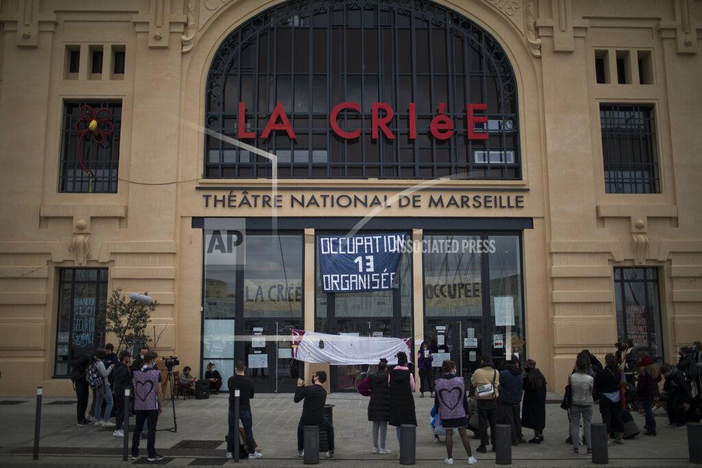 Daniel Cole Culture workers, actors, students, and theater employees attend a general assembly at the occupied Theatre de La Criee in Marseille, southern France, Friday, March 25, 2021. Out-of-work French culture and tourism workers are occupying theaters accross France to demand more government support after a year of pandemic that has devastated their incomes and put their livelihoods on indefinite hold. (AP Photo/Daniel Cole)